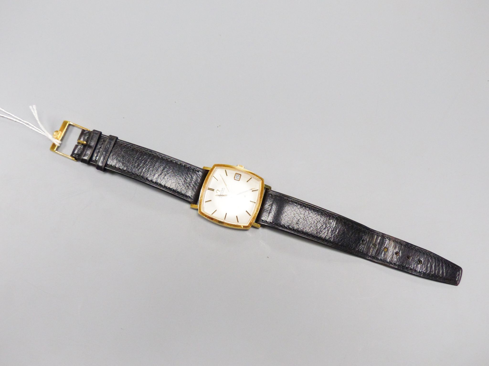 A gentleman's 1960's 18ct gold Omega De Ville automatic wrist watch, movement c.565, on Omega strap, case diameter 33mm, gross weight 40.6 grams